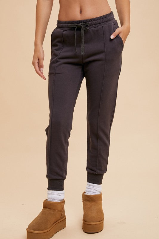 GARMENT WASHED PIPED JOGGERS