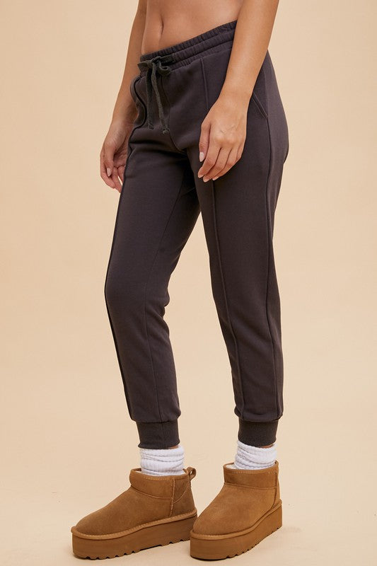 GARMENT WASHED PIPED JOGGERS